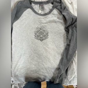 Stio sweatshirt with pine cone.